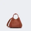 Bolso marino de piel extrapequeño, color óxido Bolso marino de piel extrapequeño, color óxido