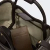 Bolso marino extrapequeño con tejido trenzado en forma de rombos, marrón oscuro Bolso marino extrapequeño con tejido trenzado en forma de rombos, marrón oscuro