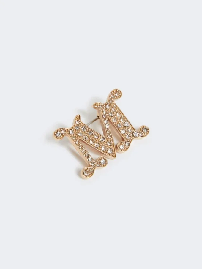 Broche con monograma adornado con cristales, blanco óptico Broche con monograma adornado con cristales, blanco óptico