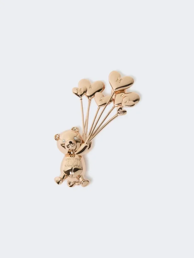 Broche de metal con pedrería,