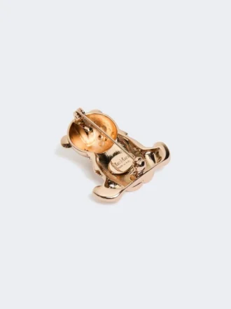 Broche de metal con pedrería,