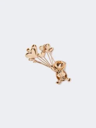 Broche de metal con pedrería,