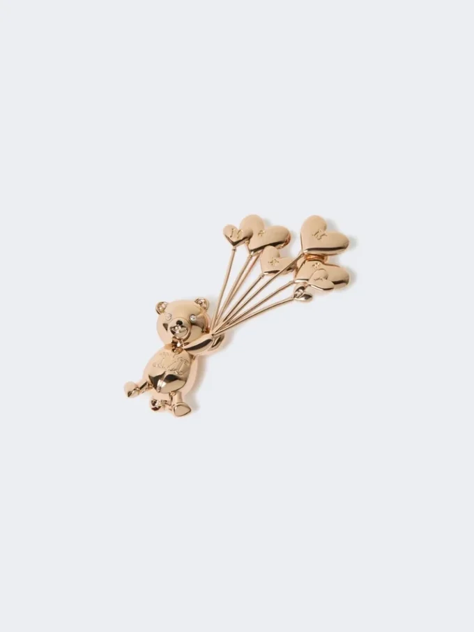 Broche de metal con pedrería,