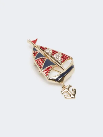 Broche de metal con pedrería, azul cielo