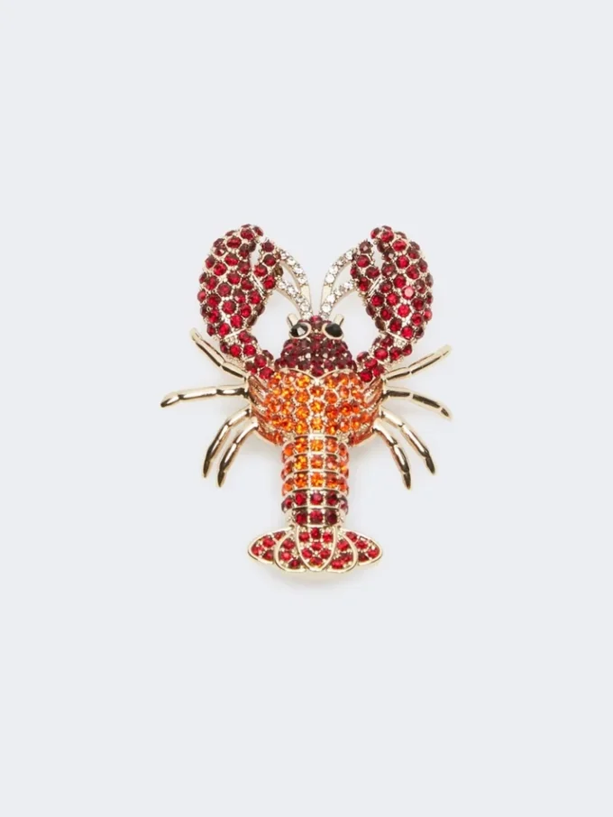 Broche de metal con pedrería, rojo oscuro Broche de metal con pedrería, rojo oscuro