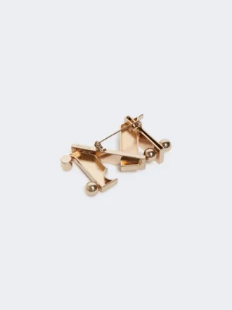 Broche metálico con monograma, dorado