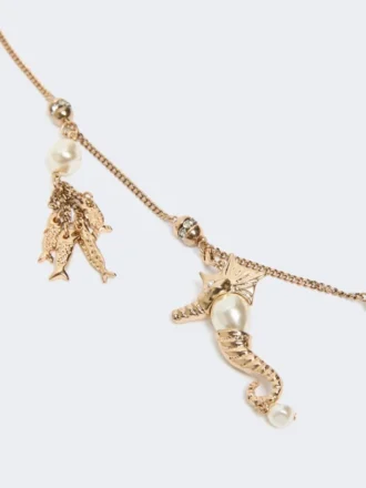 Collar metálico «Abissi» con pedrería, dorado