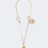 Conjunto con dijes y cristales, dorado Conjunto con dijes y cristales, dorado