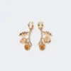 Conjunto con dijes y cristales, dorado Conjunto con dijes y cristales, dorado