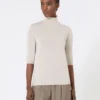 Jersey de cuello alto de punto jersey de lana, color polvo Jersey de cuello alto de punto jersey de lana, color polvo