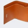 Monedero de piel de tres pliegues, color óxido Monedero de piel de tres pliegues, color óxido