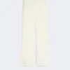 Pantalones acampanados de corte ajustado en viscosa, color marfil Pantalones acampanados de corte ajustado en viscosa, color marfil