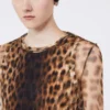 Top bimaterial con estampado animal, en tonos beige Top bimaterial con estampado animal, en tonos beige